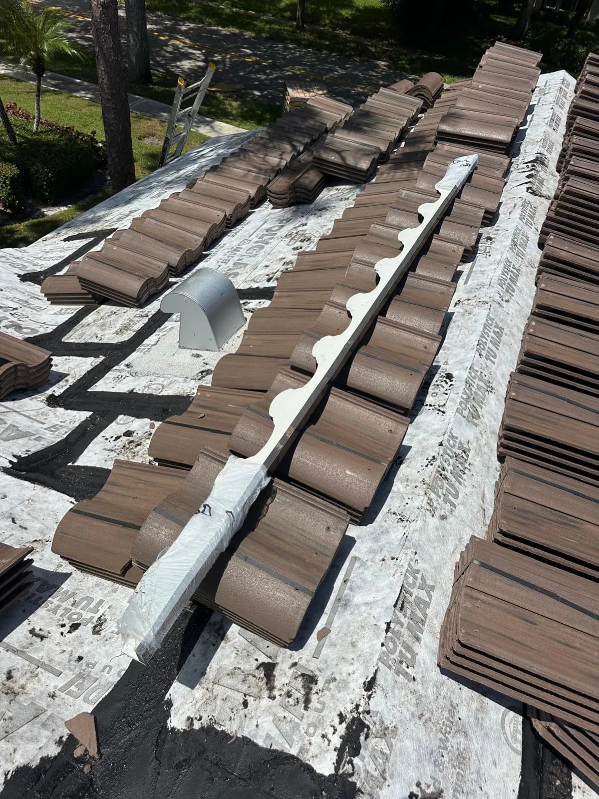 Barcelona 900 field tile and roof components organized around a roof vent