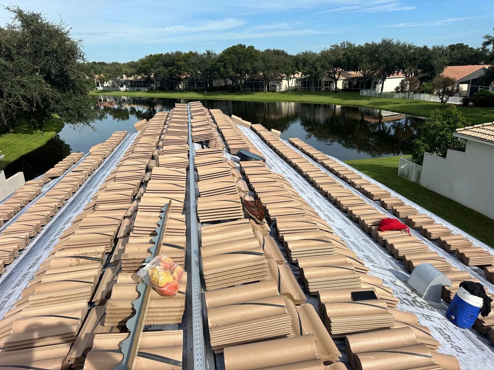 Estate roof tile distributed in rows across a prepared Delray Beach-area roof
