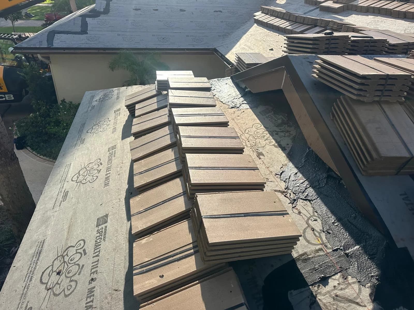 Saxony 900 Split Slate tile bundles positioned around roof features at a Jupiter-area project