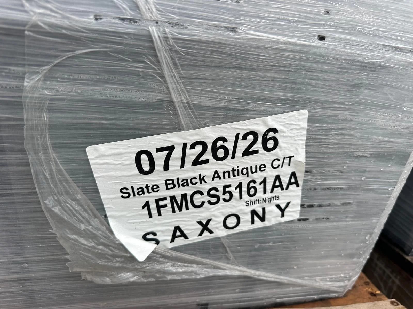 Product label identifying Slate Black Antique concrete tile in the Saxony profile