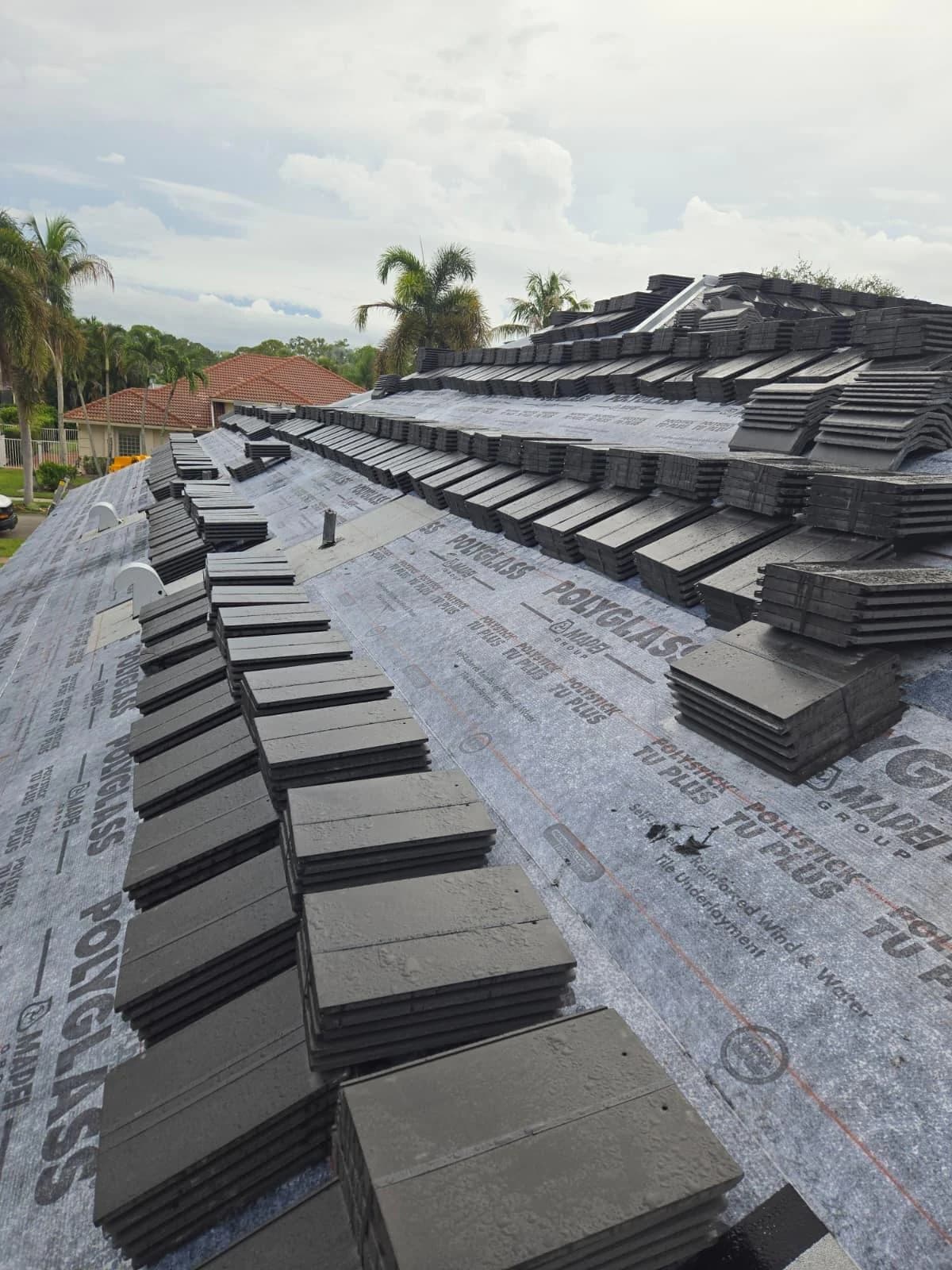 Westlake Saxony 900 Slate Black Antique tile distributed across a prepared Jupiter roof