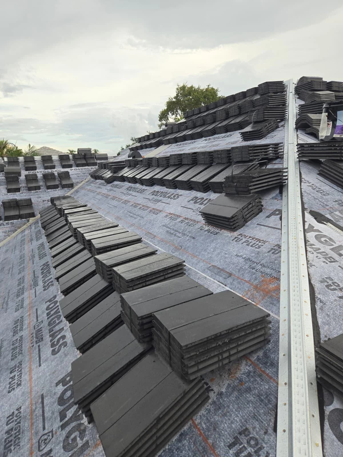 Slate Black Antique concrete roof tile staged across multiple Jupiter roof planes